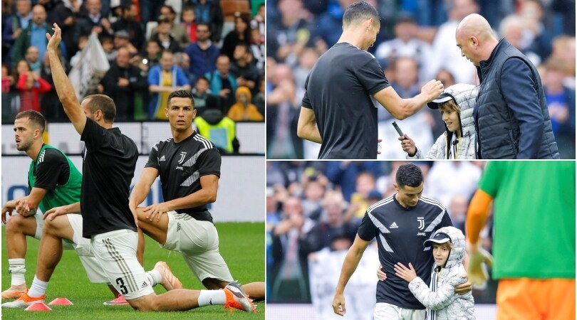 Udinese-Juventus, CR7 coccola il baby invasore: autografo e abbraccio