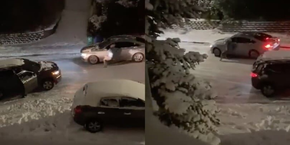L'asfalto è ghiacciato e l'auto scivola: l'automobilista tenta di fermarla!